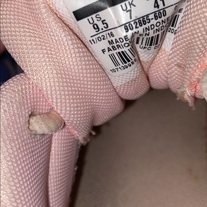 Pink/rose gold Nike tennis shoes